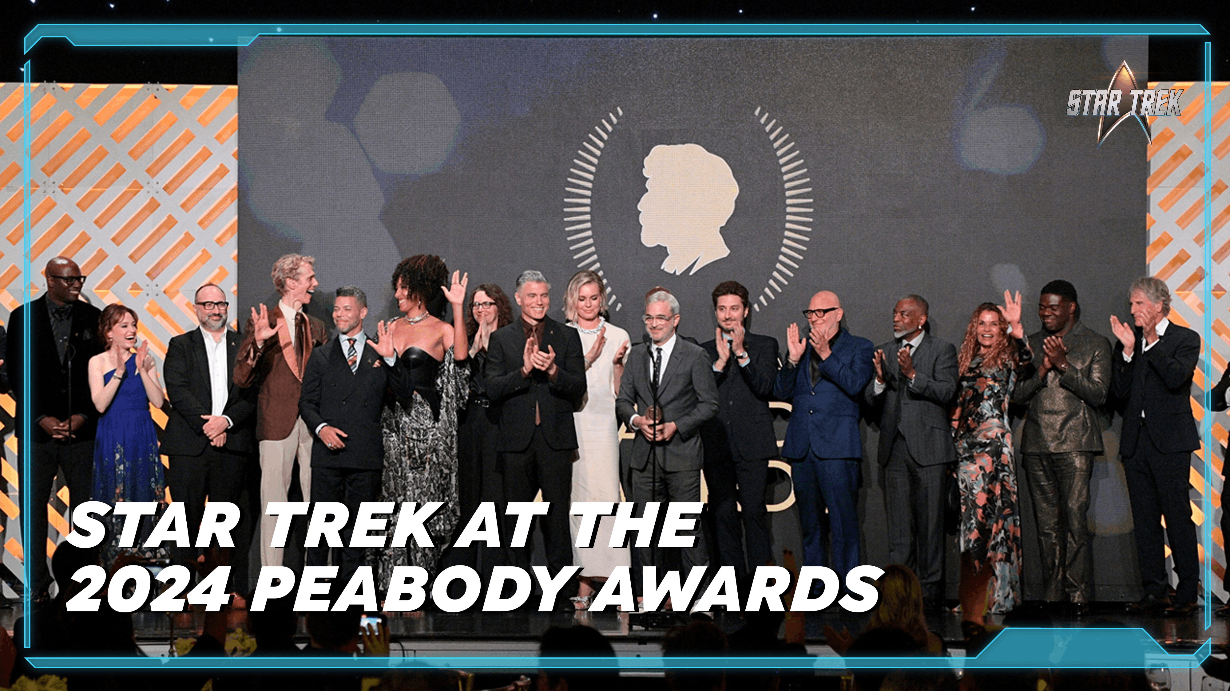 Ethan Peck, Olatunde Osunsanmi, Henry Alonso Myers, Doug Jones, Wilson Cruz, Tawny Newsome, Anson Mount, Alex Kurtzman, Terry Matalas, Akiva Goldsman, LeVar Burton, Sam Richardson, Scott Bakula and Trevor Roth accept an award onstage during the 2024 Peabody Awards